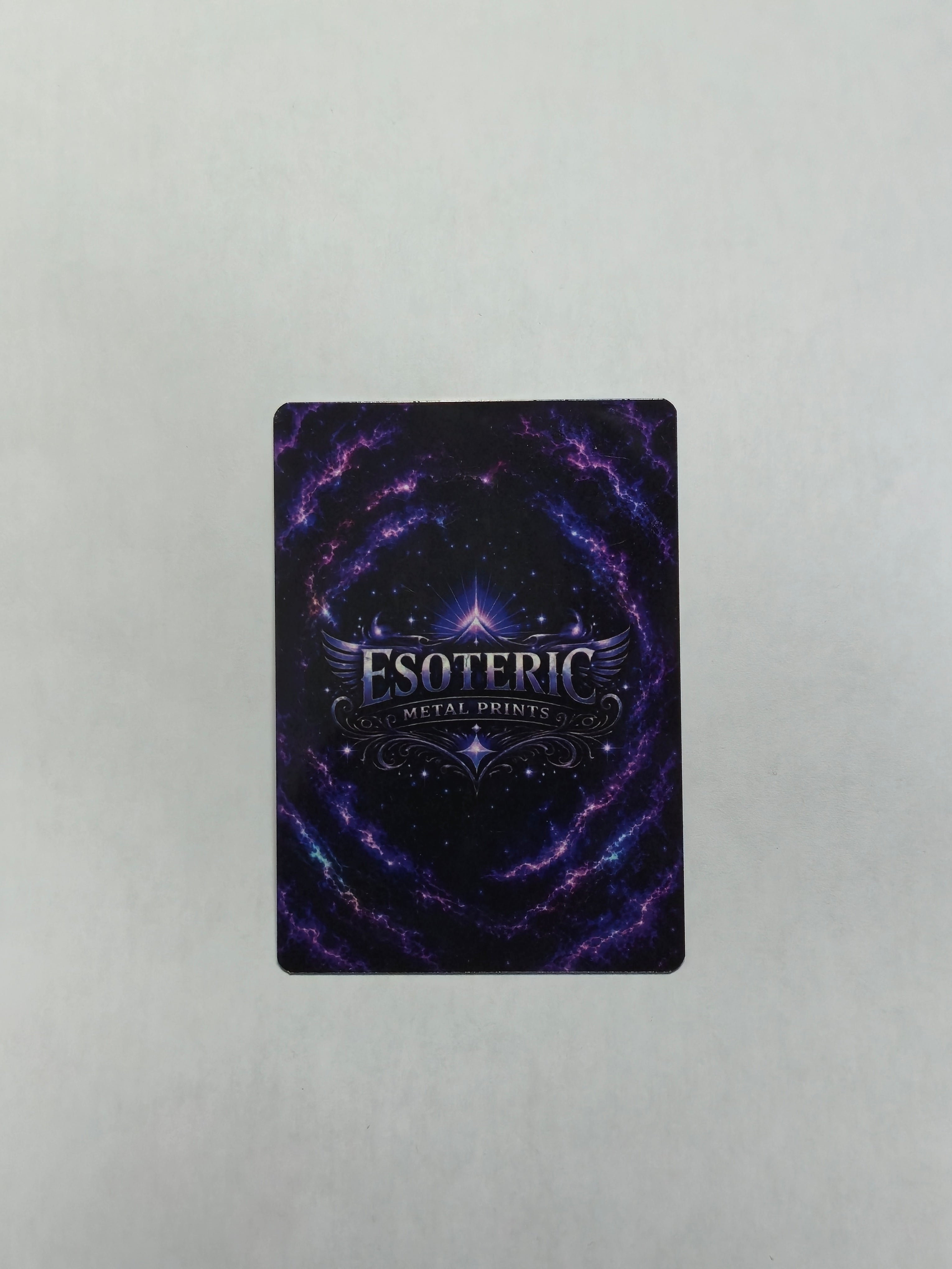 2.5 by 3.5 trading card with 'Esoteric Metal Prints' logo