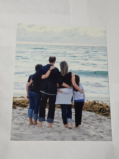 8 by 10 glossy aluminum print of a family photo of four people on a beach.